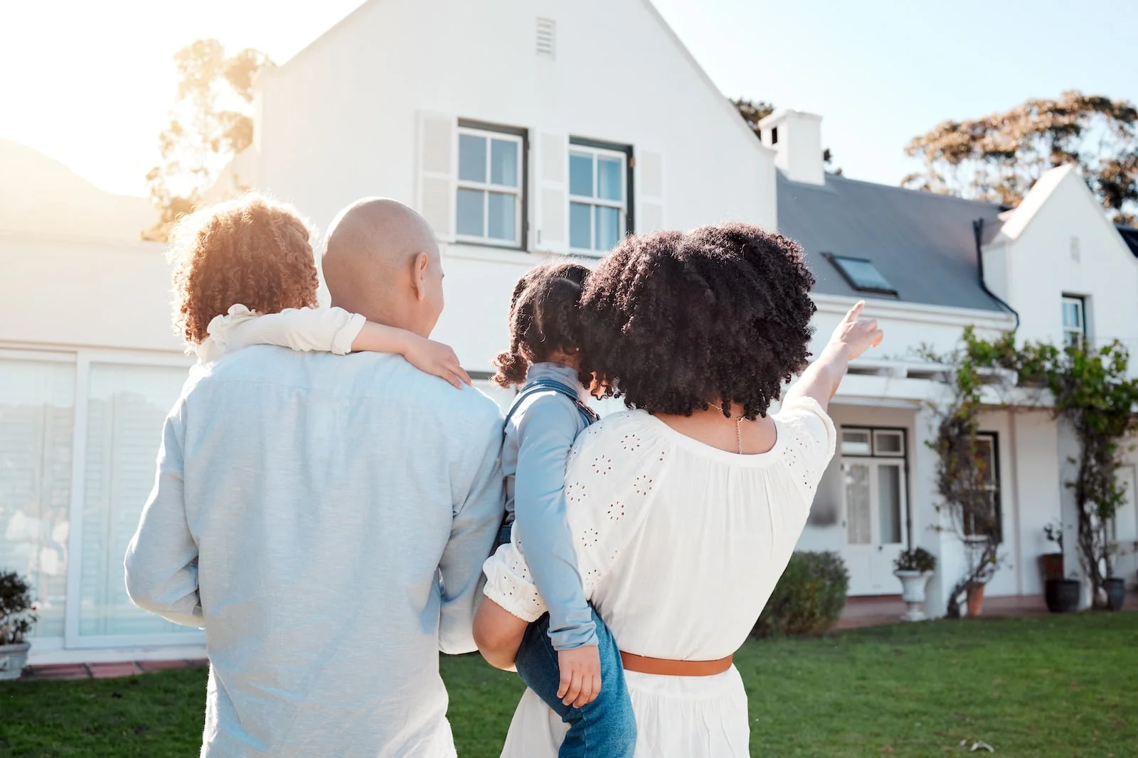 new homeowners in front of home